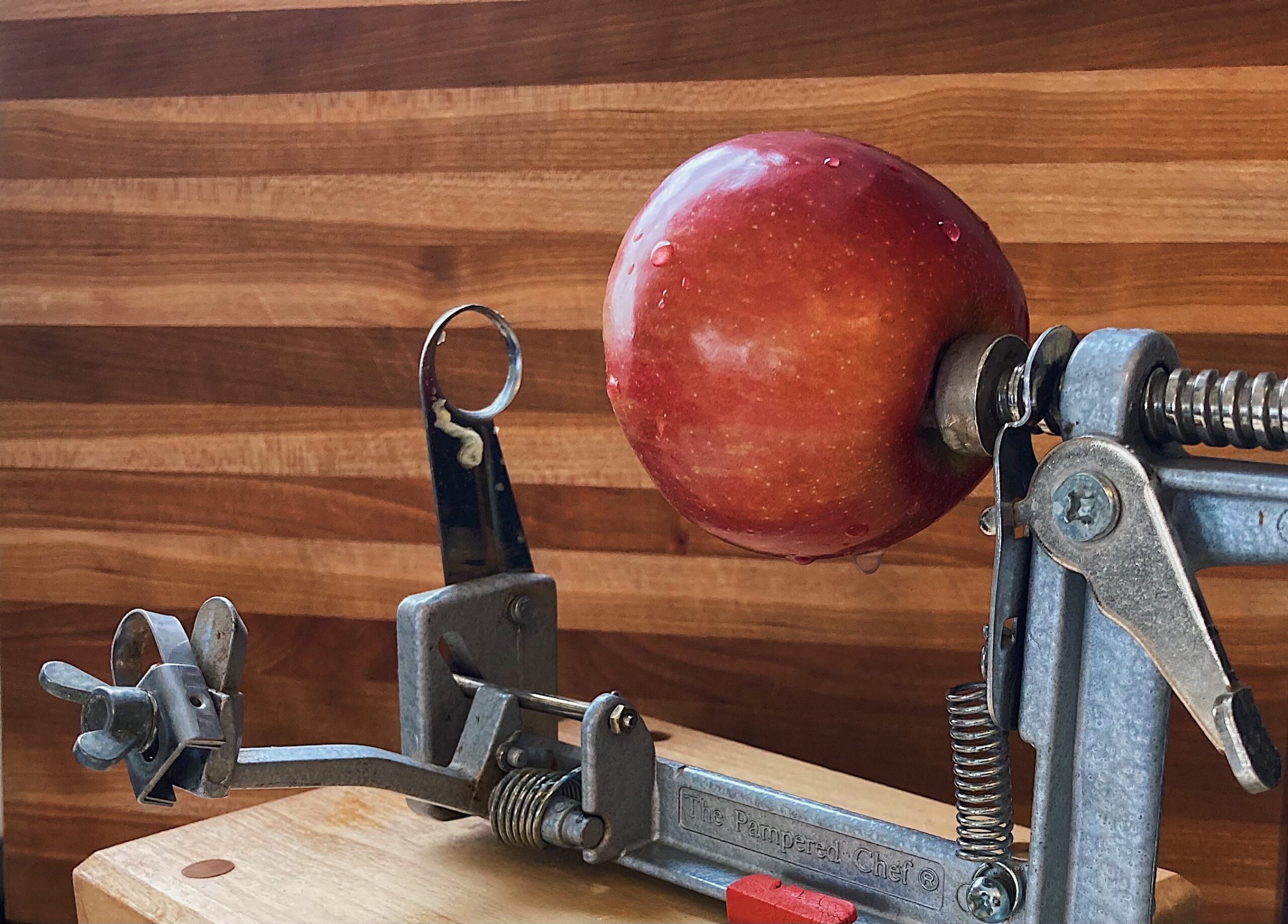 uncut apple on corer slicer peeler