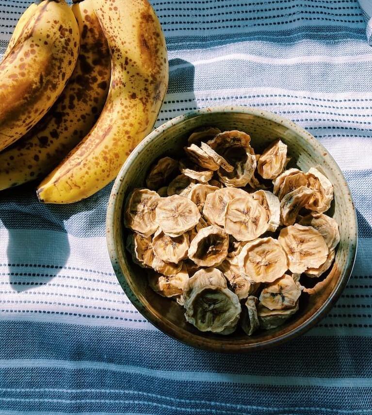 banana chips in a bowl in the sun