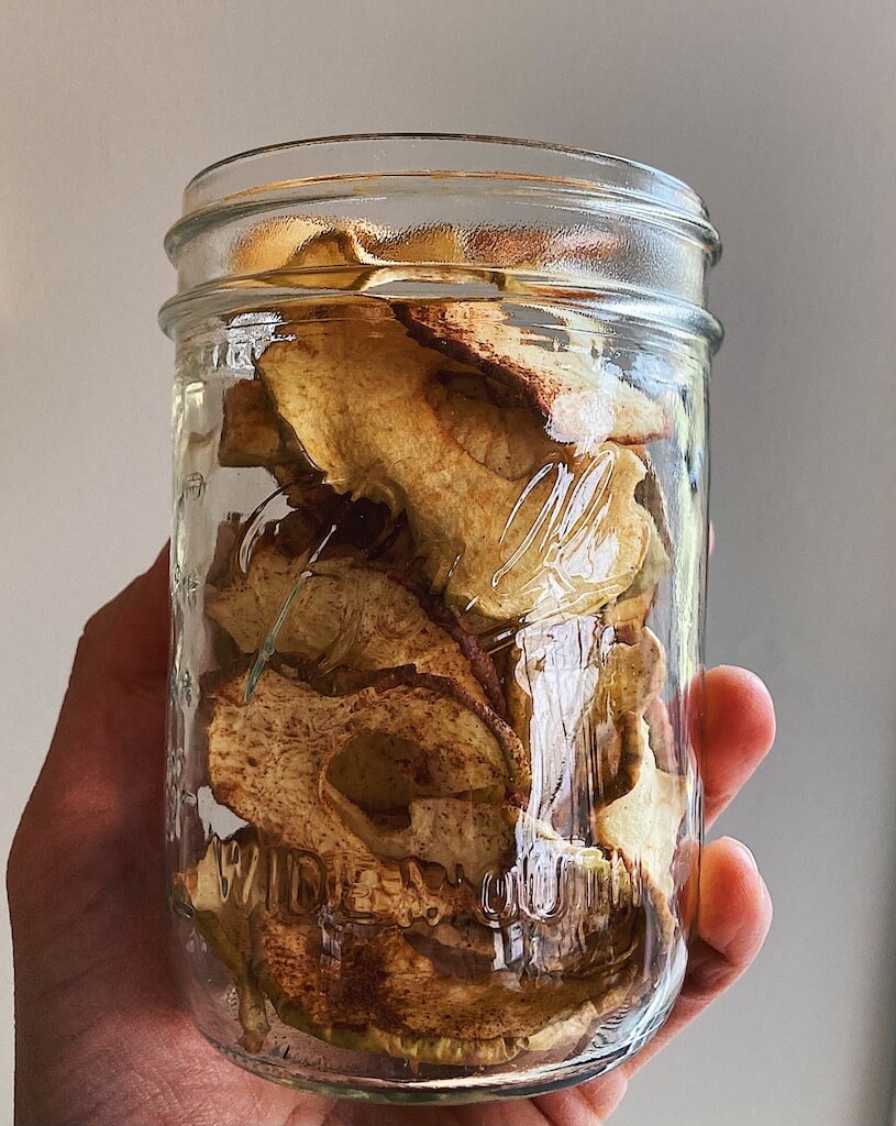 holding dehydrated apples in jar