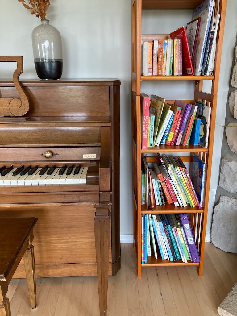 household picture of piano and toddler books