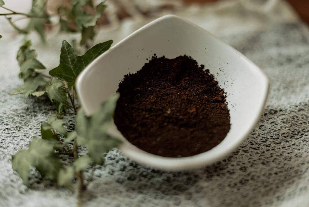a pile of coffee grounds in a small bowl