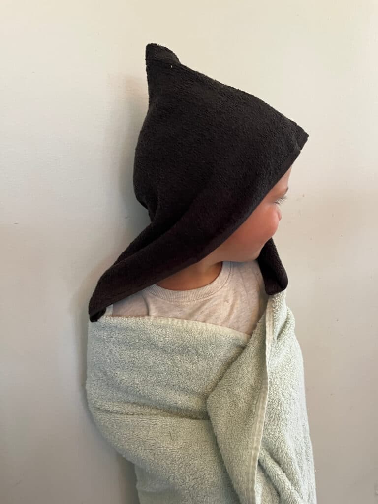 little boy wearing homemade hooded towel