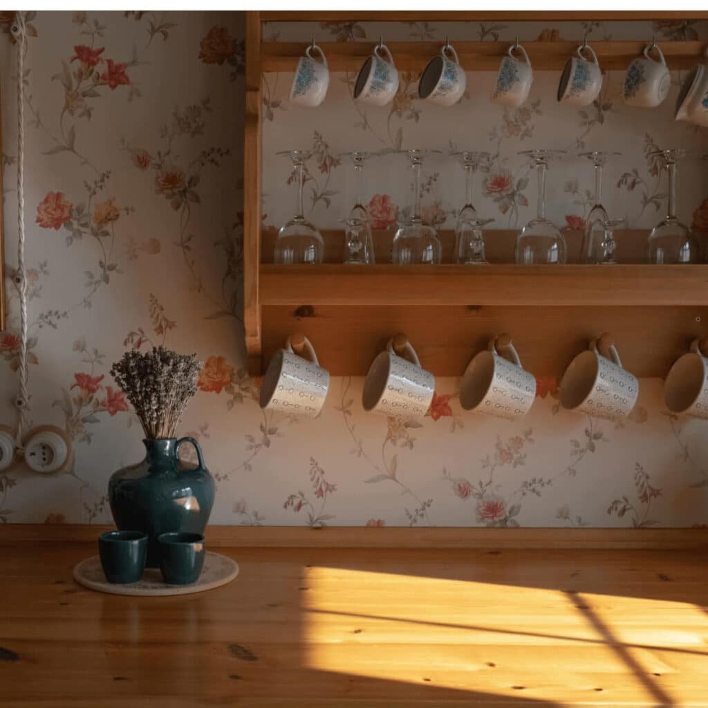 lots of mugs hanging on kitchen wall