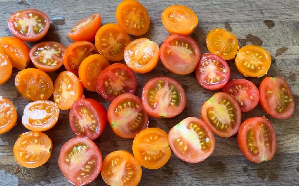 cut tomatoes on cutting board