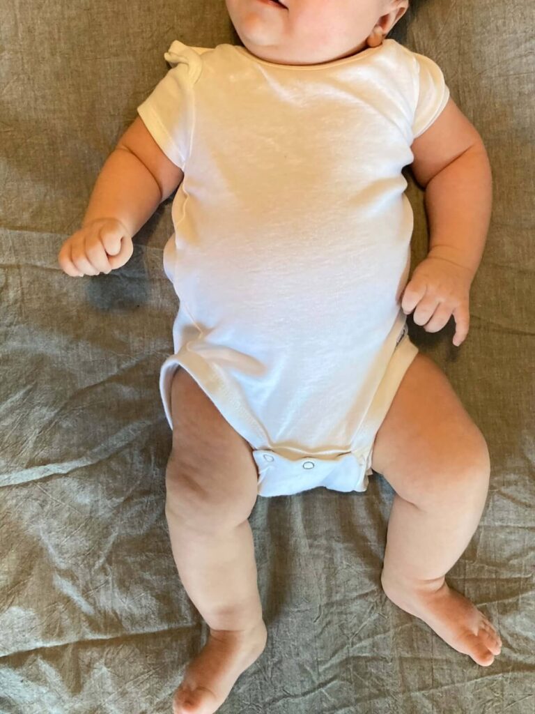white onesie on baby