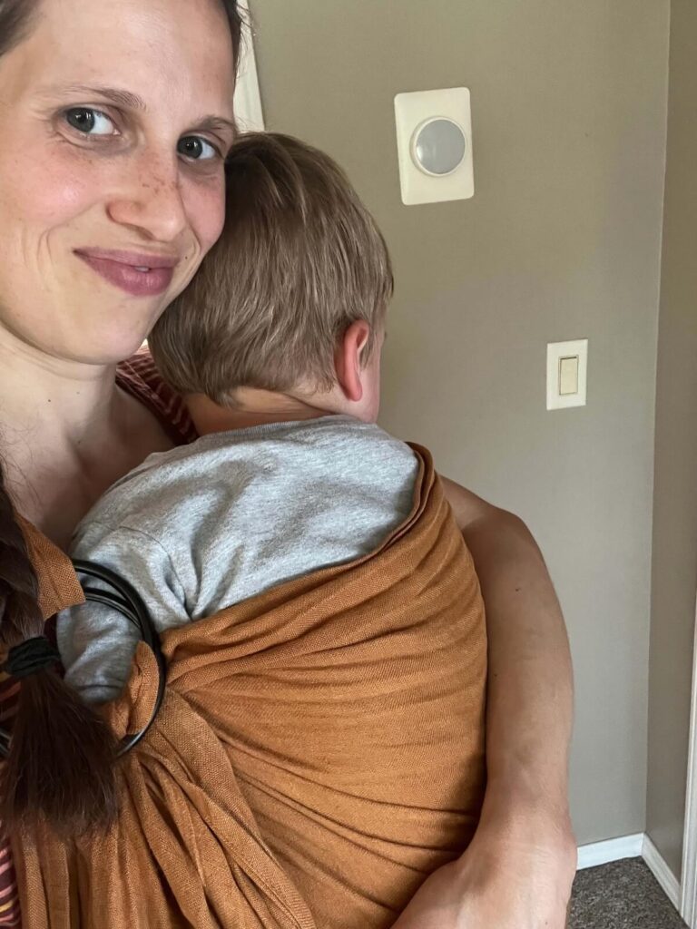 mom carrying toddler in wildbird wrap