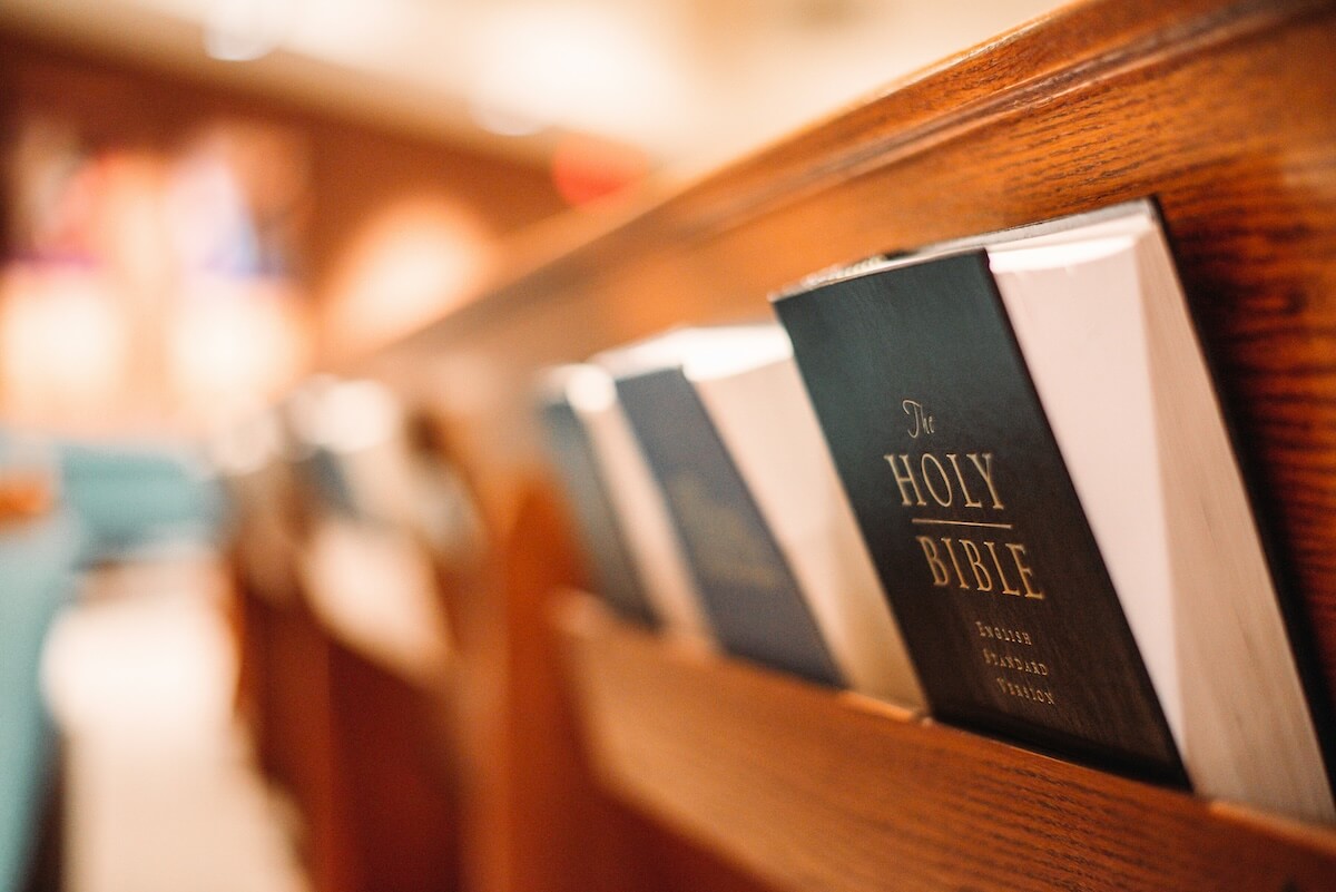 ESV bibles tucked in pew rack at church
