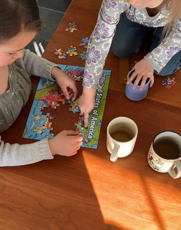 peaceful home with sisters playing a puzzle