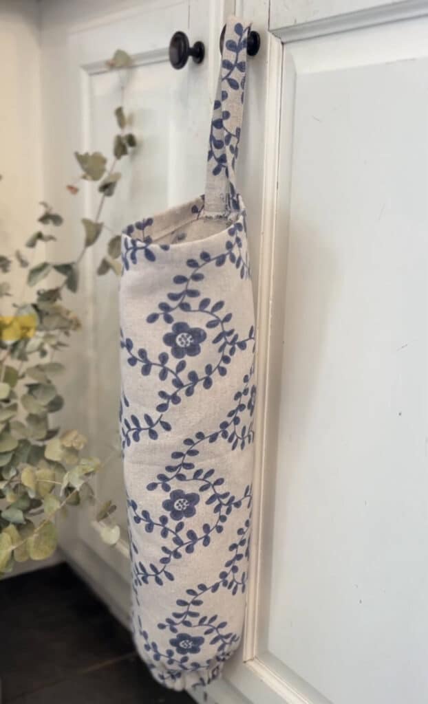 floral grocery bag dispenser hanging in kitchen