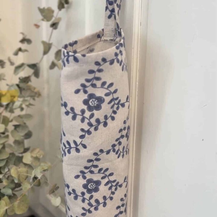 floral grocery bag dispenser hanging in kitchen