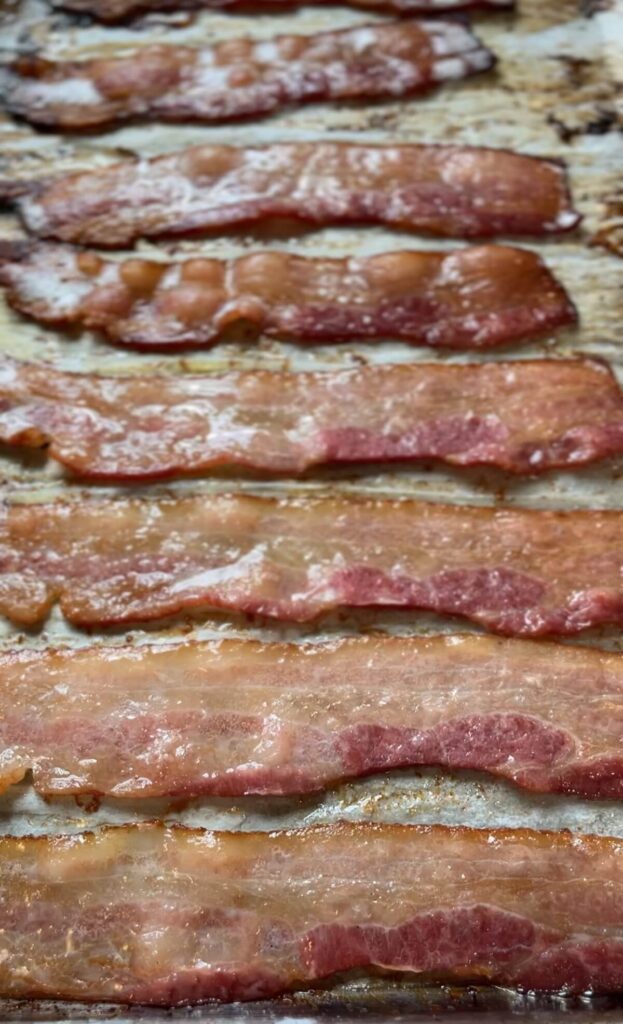 half cooked bacon in oven