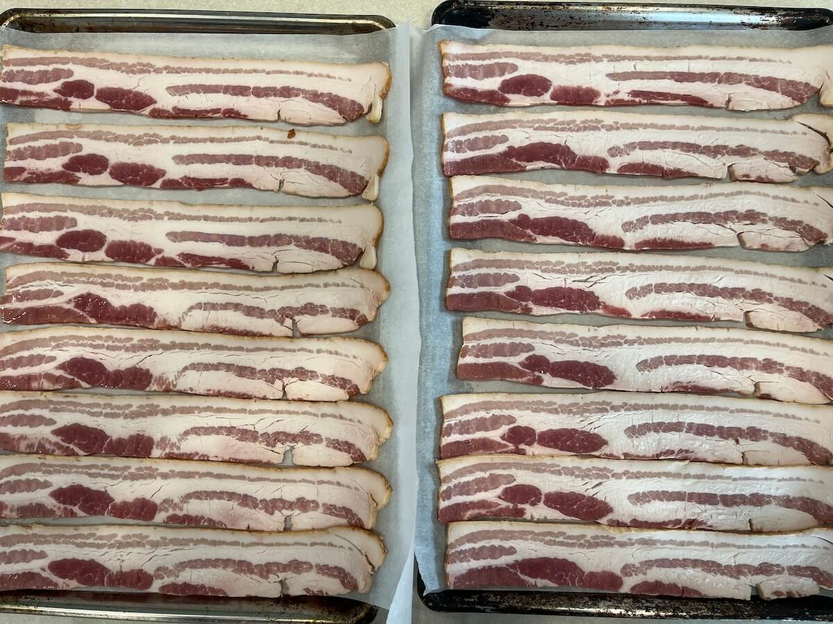 pans of uncooked bacon slices
